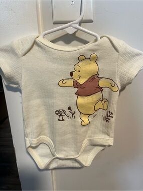 Disney Winnie the Pooh Cream One-Piece with Yellow & Brown Graphic